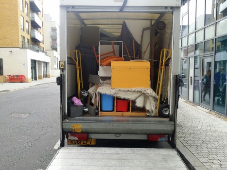 Man and van loading furniture outside a Plaistow flat